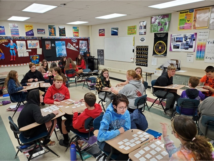 Essig home accelerated math class playing Inequality memory game preparing for their quiz.