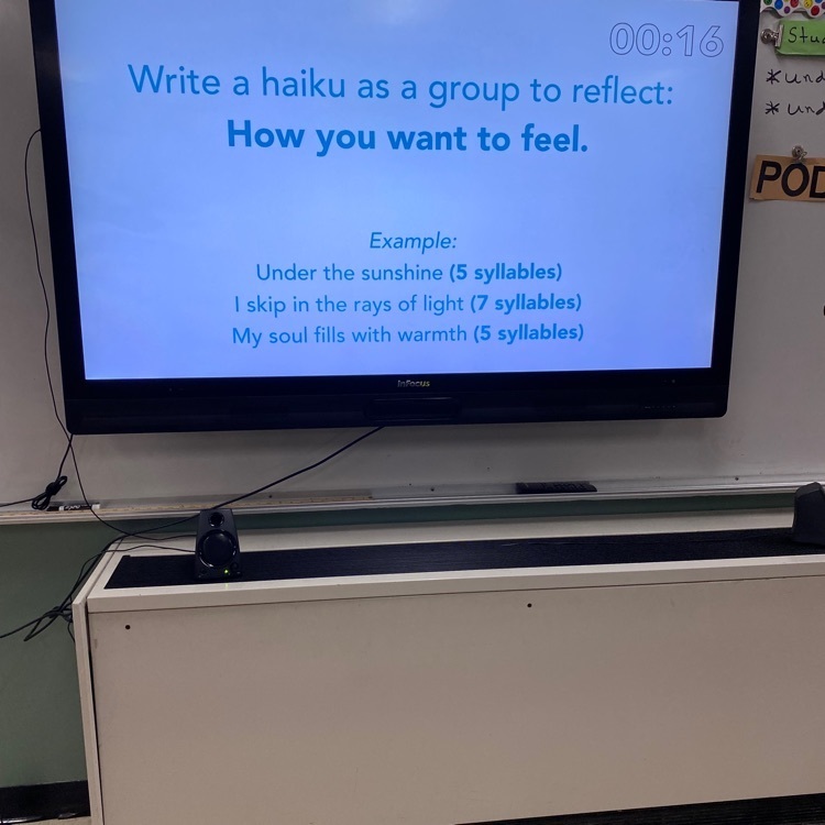 Students in Mrs. Patrick’s class got into groups for the morning “Move This World” activity. They wrote a Haiku, as a group, on their feelings and shared it with their classmates. 